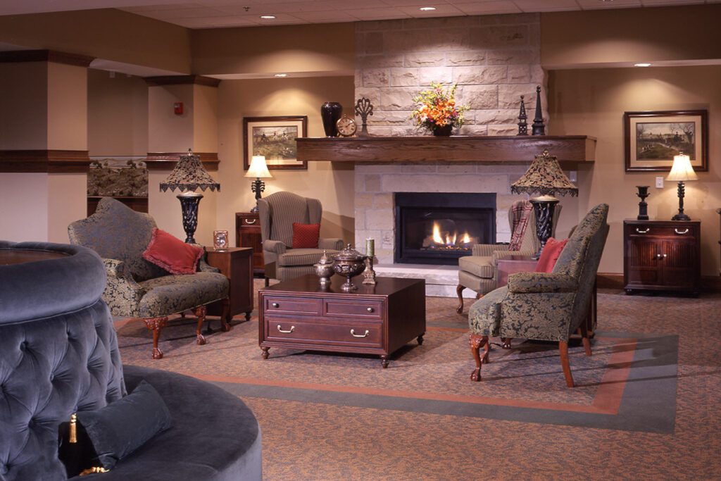 A gas fireplace burns in the cozy Fireside Lounge at Avalon Square.